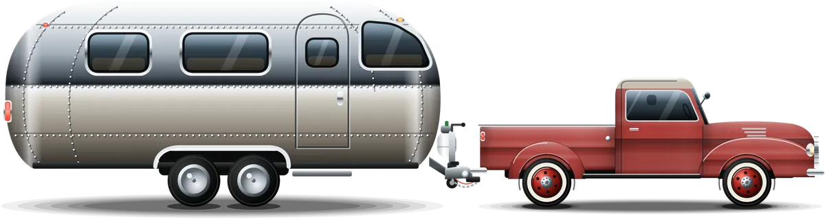 The silver tube trailer: a polished, riveted aluminum camper with rounded ends, towed by a red classic pickup with whitewall tires.